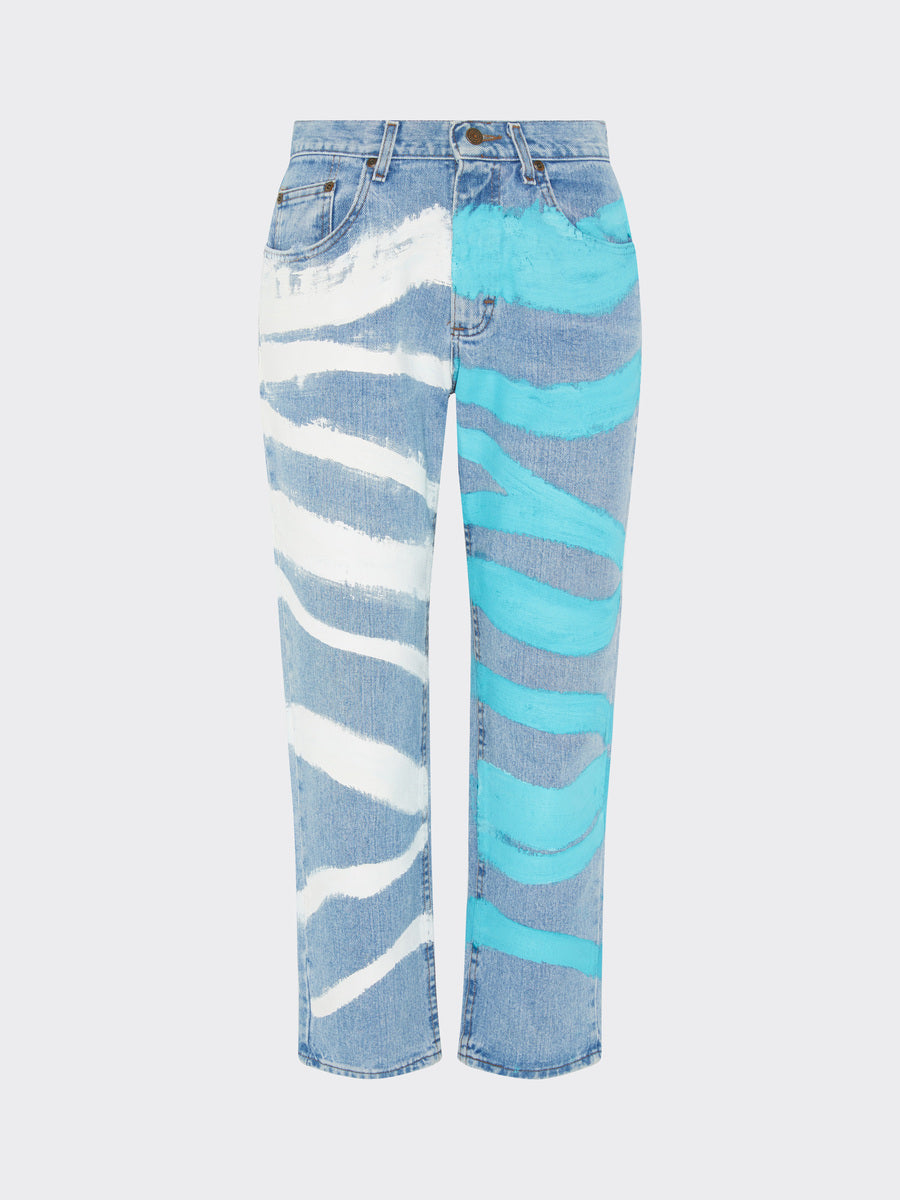 Fanfare Label sustainable women’s clothing brand UK. Our upcycled jeans are high-waisted, blue denim and made from recycled denim. We decorate every jean with a white & blue paint design.