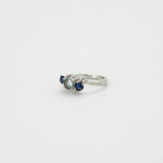 Bague or gris, aigue-marine, saphirs et diamants