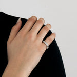 DIOR - Bague  "Gourmette", or gris et diamants.