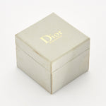 DIOR - Bague  "Gourmette", or gris et diamants.
