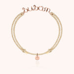 Bracelet Cordon Lurex Personnalisé porté au poignet — or rose laminé livraison express sécurisée