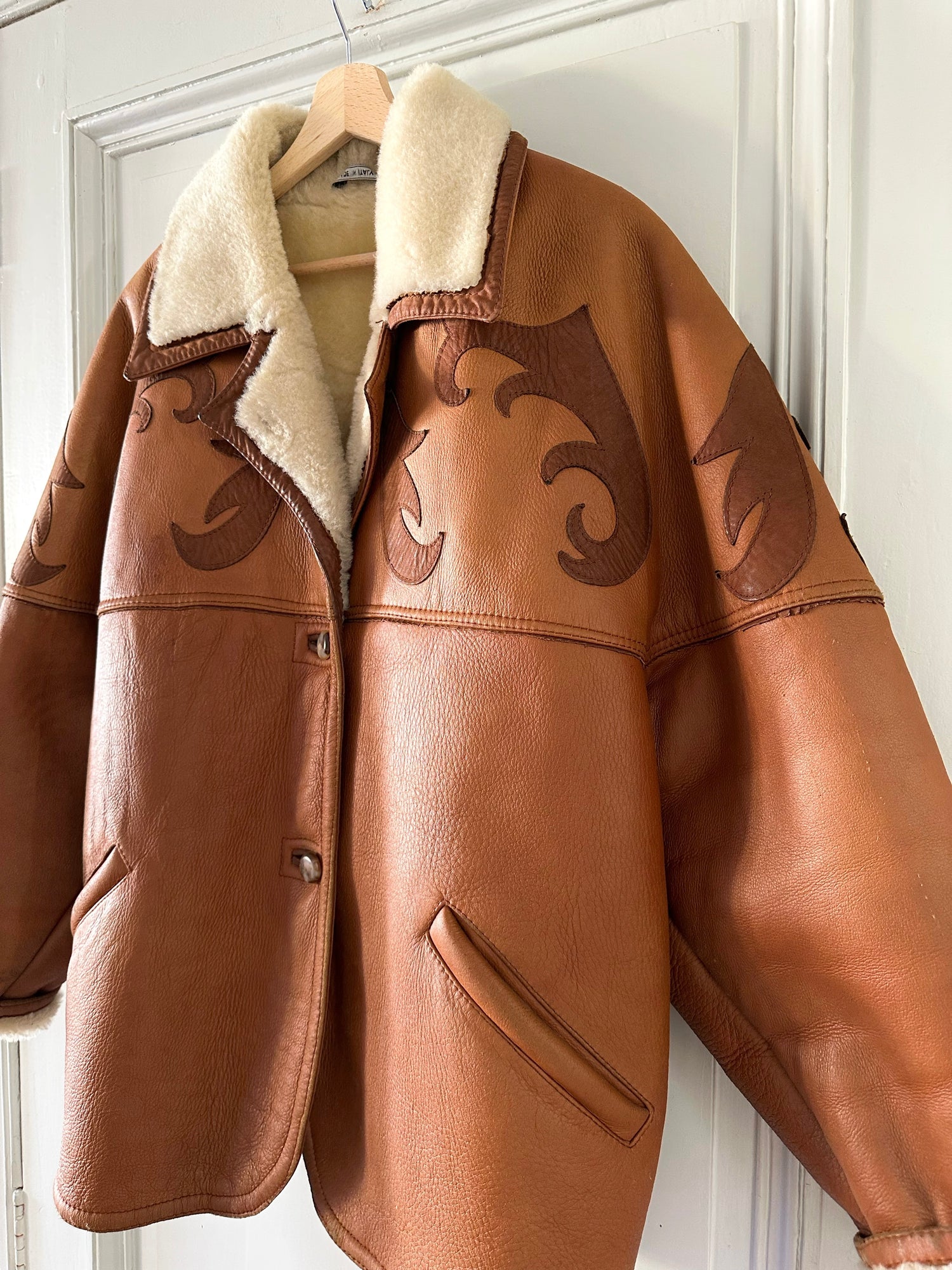 Manteau en peau lainée