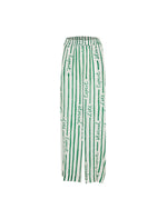 Pantalon June Vert Palmier – Tatiane de Freitas – pantalon de plage à taille haute,  jambes larges fluides, matière légère, poches, imprimé "Esprit d'été éternel", beachwear chic femme Lyon