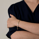 Bracelet de type gourmette en or blanc et or jaune