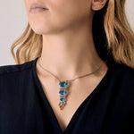 Collier en or gris, diamants et topazes bleues, citrines