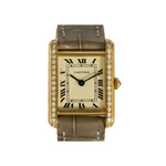 Cartier Montre Tank en or jaune et diamants