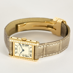 Cartier Montre Tank en or jaune et diamants