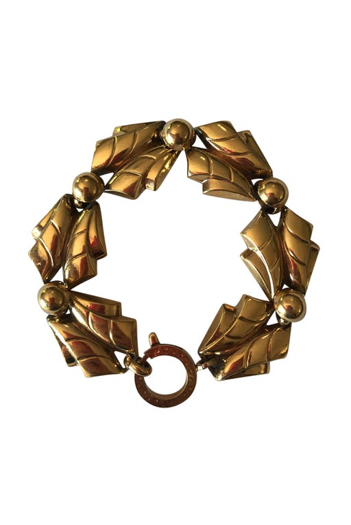 Leaf motif charm bracelet in gold metal