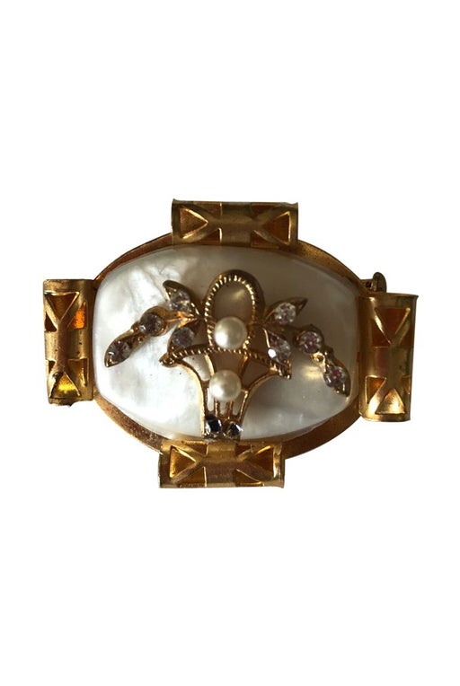 Gold metal brooch with stone effect