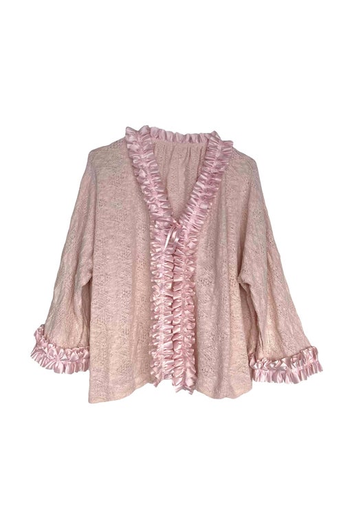 Pastel pink knit cardigan with ruffles