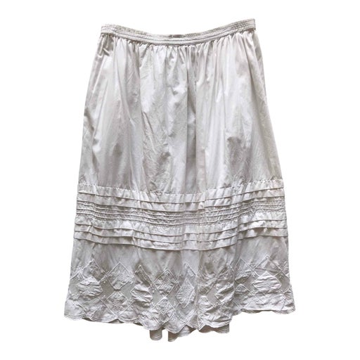 White midi skirt with embroidery on the