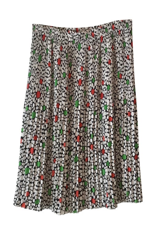 Pleated skirt with white, green and red polka dots