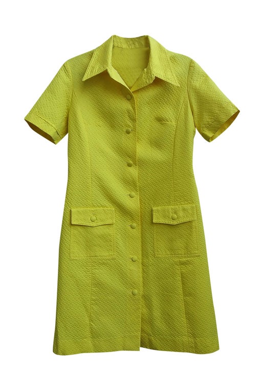 Bright yellow short dress. Embossed fabric. Of