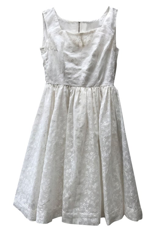 White lace dress with leaf patterns