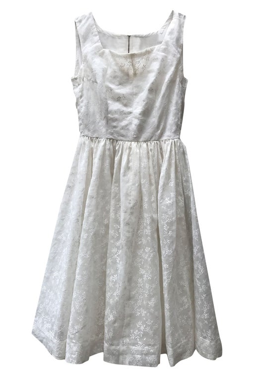 White lace dress with leaf patterns