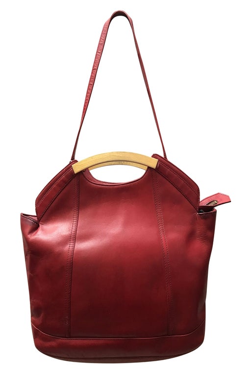 Red leather bag with a shoulder strap,