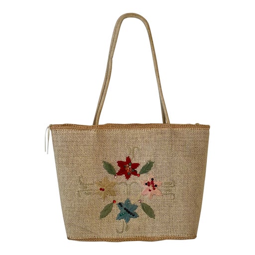 Basket in woven raffia and embroidered with fl