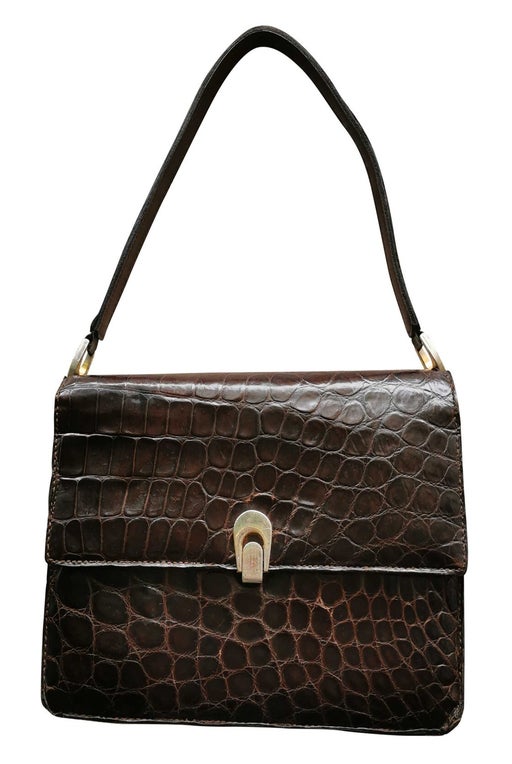 Crocodile and metal handbag