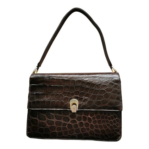 Crocodile and metal handbag
