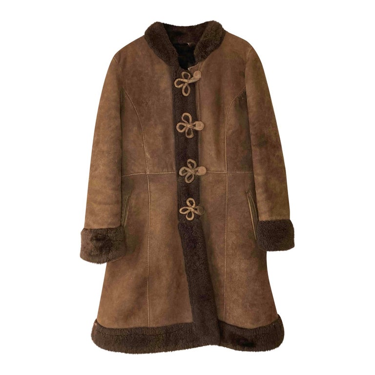 Manteau long en peau lainée 