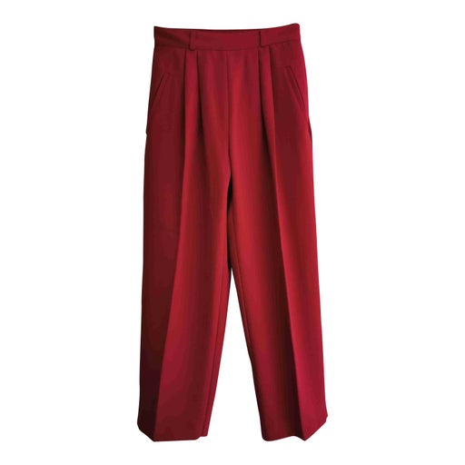 Red pleated trousers