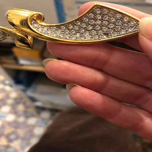 Golden rhinestone brooch