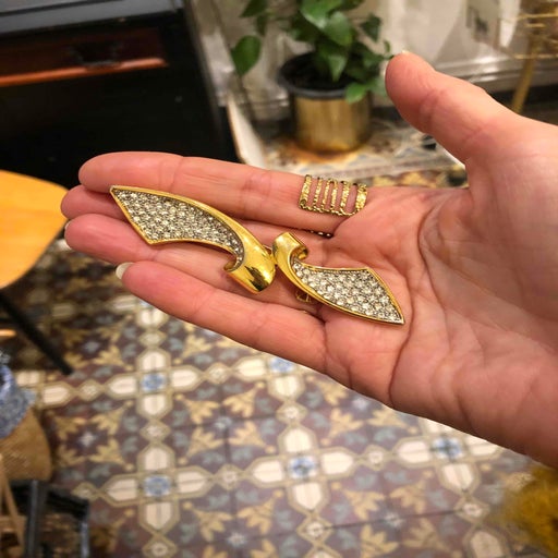 Golden rhinestone brooch