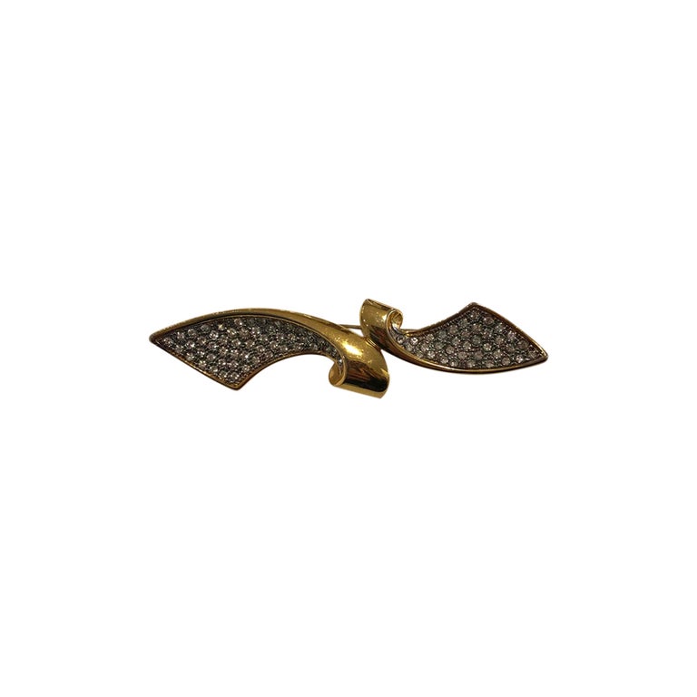 Golden rhinestone brooch