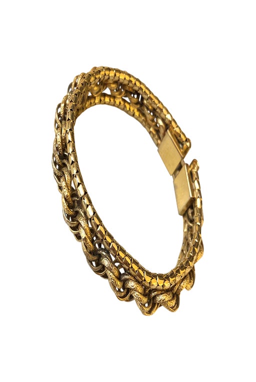 Rigid golden metal bracelet.