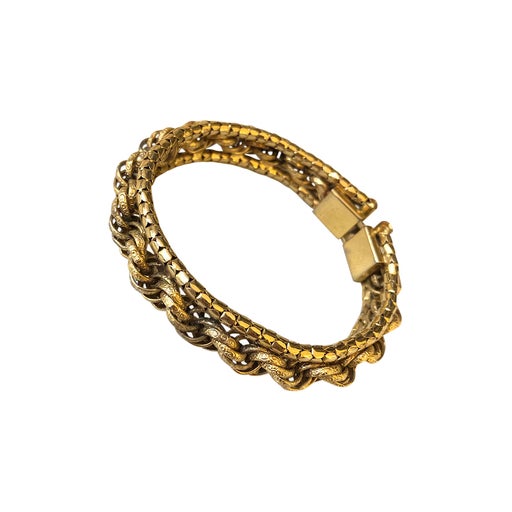 Bracelet en métal doré rigide.