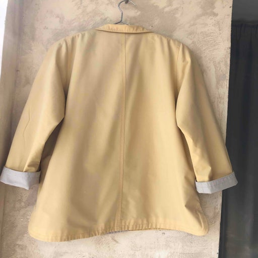 Pastel yellow trench coat