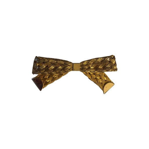 Golden metal brooch