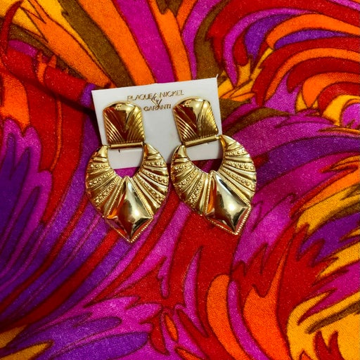 Golden metal earrings
