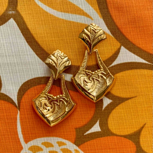 Golden metal earrings
