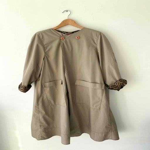Collarless trench coat