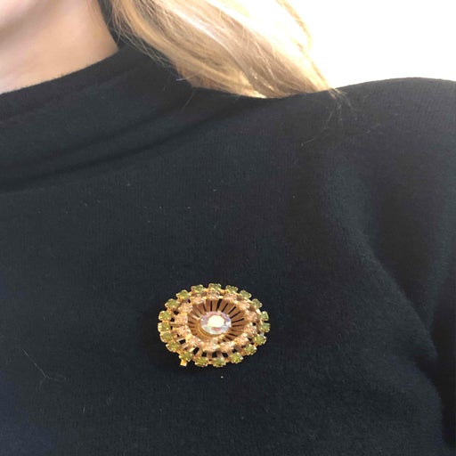 Golden metal brooch