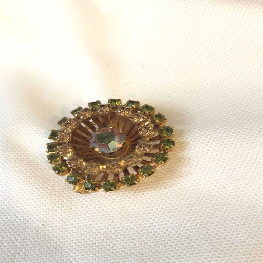 Golden metal brooch