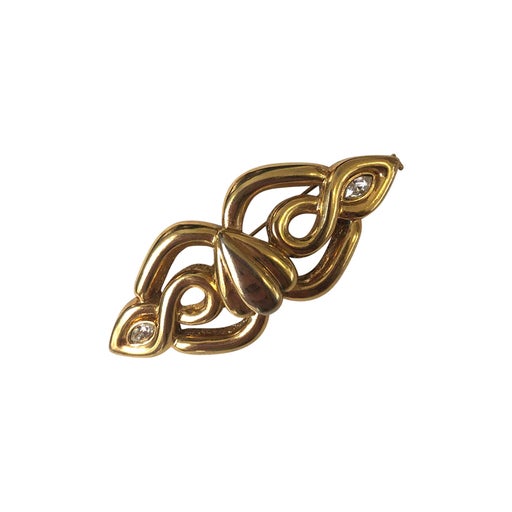 Golden metal brooch