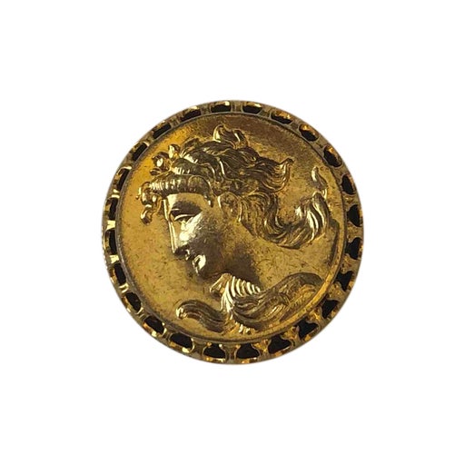 Golden metal brooch