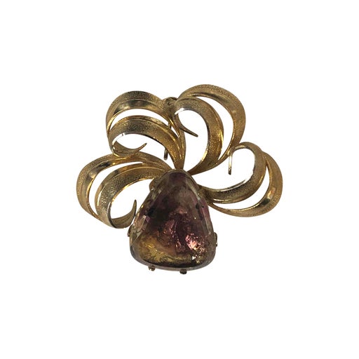 Golden metal brooch