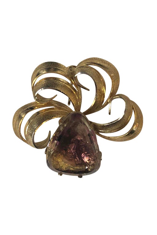 Golden metal brooch