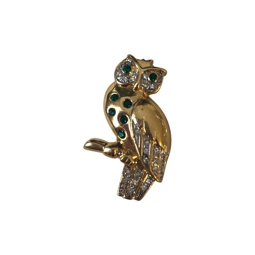 Golden metal brooch