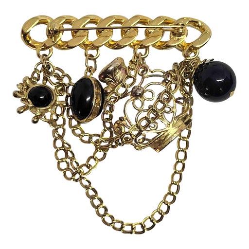 Golden metal brooch