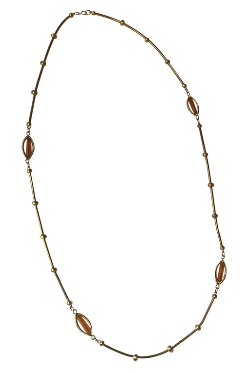 Long necklace in golden metal