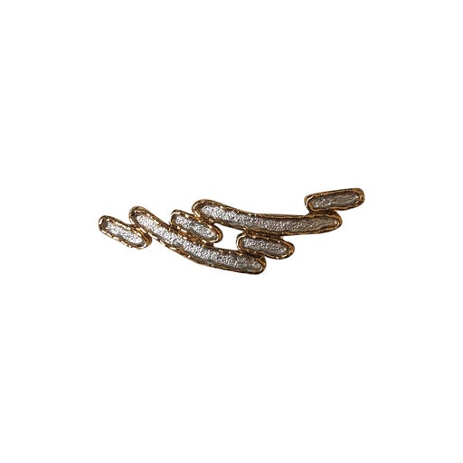 Golden metal brooch