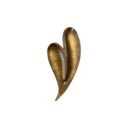 Golden metal brooch