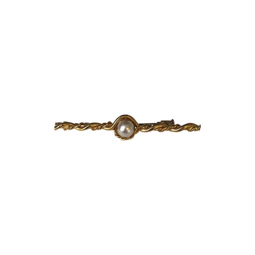 Golden metal brooch