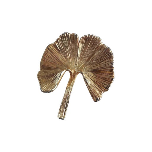 Golden metal brooch