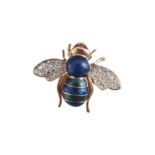Golden metal brooch