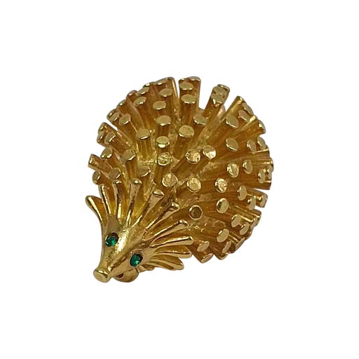 Golden metal brooch